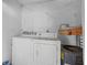 Compact laundry room featuring a washer and dryer at 3946 Versailles Dr # 3946B, Orlando, FL 32808