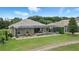 Aerial view of backyard with covered pool, pavers, outdoor seating, and grass at 3995 Equine Cv, Lake Mary, FL 32746