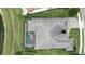 Aerial view of home with screened pool, patio, and driveway at 3995 Equine Cv, Lake Mary, FL 32746