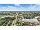 Stunning aerial view of community, positioned near main highway and serene lake at 3995 Equine Cv, Lake Mary, FL 32746