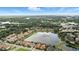 Aerial view featuring lake and nearby homes at 3995 Equine Cv, Lake Mary, FL 32746