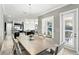 Spacious dining area with large windows offers seamless flow to kitchen and living spaces at 3995 Equine Cv, Lake Mary, FL 32746