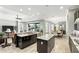 Gourmet kitchen featuring granite countertops, dark cabinetry, stainless steel appliances, with an outdoor dining area view at 3995 Equine Cv, Lake Mary, FL 32746