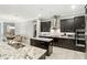 A chef's kitchen featuring stainless steel appliances, dark cabinetry, and granite countertops at 3995 Equine Cv, Lake Mary, FL 32746