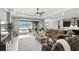 Bright living room with outdoor access, offering an seamless indoor-outdoor experience with pool view at 3995 Equine Cv, Lake Mary, FL 32746