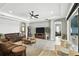 Relaxing living room with access to outdoor spaces, and a seamless transition to adjacent rooms at 3995 Equine Cv, Lake Mary, FL 32746