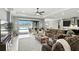 Spacious living room with outdoor access, offering an seamless indoor-outdoor experience with pool view at 3995 Equine Cv, Lake Mary, FL 32746