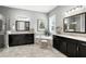 Luxurious bathroom features dual vanities, soaking tub, and elegant mirrors at 3995 Equine Cv, Lake Mary, FL 32746