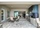 Outdoor kitchen with stainless steel grill, mosaic tile backsplash, and comfortable seating, perfect for entertaining at 3995 Equine Cv, Lake Mary, FL 32746