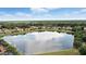 Picturesque view of community homes and the beautiful lake at 3995 Equine Cv, Lake Mary, FL 32746