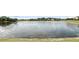 Scenic view of community pond and surrounding homes at 3995 Equine Cv, Lake Mary, FL 32746