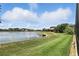 Community pond with manicured green space at 3995 Equine Cv, Lake Mary, FL 32746