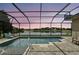 Screened-in pool with serene water views, light brick pavers, and chairs provide a great place to enjoy the outdoors at 3995 Equine Cv, Lake Mary, FL 32746