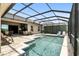 Comfortable outdoor space with covered pool, brick pavers, an outdoor grill, and several seating areas at 3995 Equine Cv, Lake Mary, FL 32746