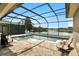 Enclosed pool area overlooking the lake is perfect for outdoor lounging with an extended brick paver patio at 3995 Equine Cv, Lake Mary, FL 32746