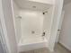 Bathroom featuring a clean, white tiled shower and tub, providing a simple and functional space at 412 Ranch Trl, Casselberry, FL 32707