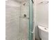 Bathroom with white tile, glass shower, and modern fixtures at 412 Ranch Trl, Casselberry, FL 32707