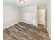 Bright bedroom with hardwood floors, closet, neutral paint and natural light at 412 Ranch Trl, Casselberry, FL 32707