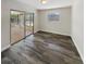 Bedroom with hardwood floors, window and sunroom access at 412 Ranch Trl, Casselberry, FL 32707