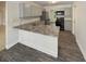 Remodeled kitchen with granite countertops, stainless steel appliances and eat in bar at 412 Ranch Trl, Casselberry, FL 32707