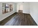 Bright living room featuring wood-look floors and a large window at 412 Ranch Trl, Casselberry, FL 32707