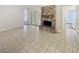 Living room featuring a stone fireplace, tile flooring, and neutral paint, creating a welcoming and cozy atmosphere at 412 Ranch Trl, Casselberry, FL 32707