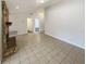 Spacious living room with stone fireplace and tile flooring, ready for personalized touches at 412 Ranch Trl, Casselberry, FL 32707
