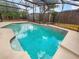 Refreshing pool area with screened enclosure and decorative tiling, perfect for outdoor relaxation and entertainment at 412 Ranch Trl, Casselberry, FL 32707