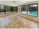 Bright sunroom overlooking backyard pool area and well-maintained tiles at 412 Ranch Trl, Casselberry, FL 32707