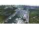 An aerial view shows the waterfront marina with multiple boat slips and condominiums at 4628 Harbour Village Blvd # 2308, Ponce Inlet, FL 32127