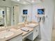 Elegant bathroom with double sinks, and a large mirror at 4628 Harbour Village Blvd # 2308, Ponce Inlet, FL 32127