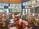 The club house includes a restaurant with tables and chairs and walls of window views at 4628 Harbour Village Blvd # 2308, Ponce Inlet, FL 32127
