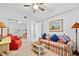 Cozy living room featuring a comfortable sofa and a stylish ceiling fan at 4628 Harbour Village Blvd # 2308, Ponce Inlet, FL 32127