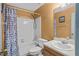 Cozy bathroom with a shower-tub combo and neutral finishes at 4870 S Semoran Blvd # 1904, Orlando, FL 32822