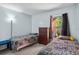 Bedroom featuring twin beds, dresser, and natural light through the window at 4870 S Semoran Blvd # 1904, Orlando, FL 32822