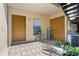 Inviting entryway with tiled floors, neutral walls, a decorative table setting, and stairway access to the above unit at 4870 S Semoran Blvd # 1904, Orlando, FL 32822