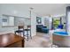 The Living Room features modern furniture, light blue walls, and bar stool seating from the open floor plan at 4870 S Semoran Blvd # 1904, Orlando, FL 32822