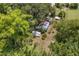 Aerial view of the property and surrounding trees at 516 Tybee Pl, Orlando, FL 32829