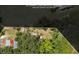 Aerial view of property with rough estimates and surrounding trees in the community at 516 Tybee Pl, Orlando, FL 32829
