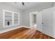Bedroom featuring hardwood floors, natural light, and open doorway at 516 Tybee Pl, Orlando, FL 32829