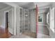 A versatile space with built-in shelves offers easy access to an adjacent room with soft carpeting at 516 Tybee Pl, Orlando, FL 32829
