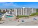 Aerial view of beachfront condos, pool, and beach access at 5201 S Atlantic Ave # 703A, New Smyrna Beach, FL 32169
