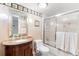 Bathroom with granite counters, decorative wallpaper border, shower and tub combination at 5201 S Atlantic Ave # 703A, New Smyrna Beach, FL 32169