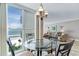 Bright dining area with large windows offering ocean views, perfect for enjoying meals with a scenic backdrop at 5201 S Atlantic Ave # 703A, New Smyrna Beach, FL 32169