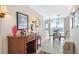 Open concept dining area with ocean views and stylish decor, creating an inviting atmosphere for gatherings at 5201 S Atlantic Ave # 703A, New Smyrna Beach, FL 32169