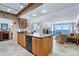 Open kitchen with a kitchen island that flows seamlessly into the living area with views of the ocean at 5201 S Atlantic Ave # 703A, New Smyrna Beach, FL 32169