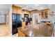 Modern kitchen with stainless steel appliances, granite countertops, and ample cabinet space at 5201 S Atlantic Ave # 703A, New Smyrna Beach, FL 32169