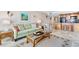 Cozy living room featuring a comfortable sofa and stylish decor, adjacent to kitchen for easy entertaining at 5201 S Atlantic Ave # 703A, New Smyrna Beach, FL 32169