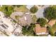 Aerial view of rooftops, neighborhood streets, and a lot of construction debris at 5300 Locksley Ave, Orlando, FL 32810
