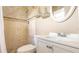 Bathroom featuring decorative tiled shower and an elegant sink and vanity at 5300 Locksley Ave, Orlando, FL 32810